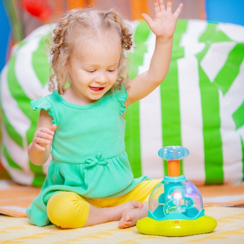 Дзиґа музична Bright Starts "Press & Glow Spinner", від 6 - ти міс